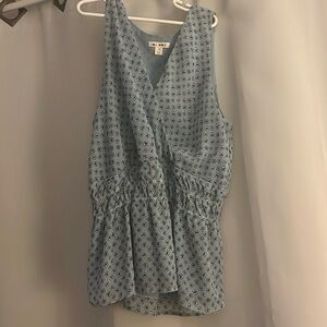 Tank top light blue flowery blouse.